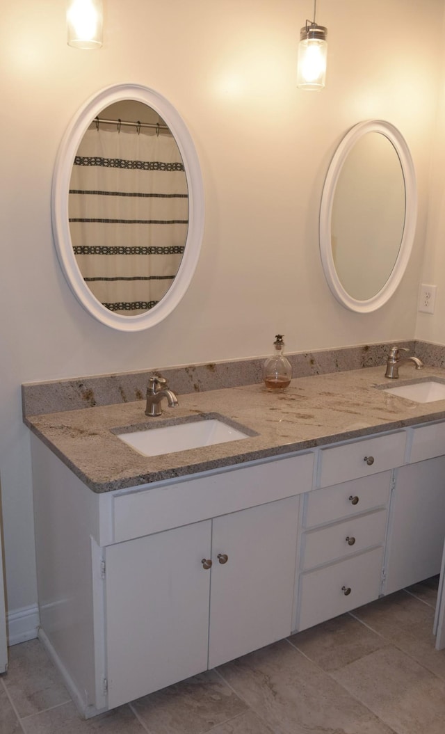 bathroom featuring vanity and tile patterned flooring