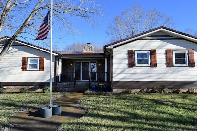 view of front of property with covered porch and a front lawn