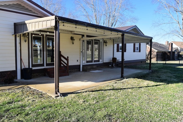 exterior space with a front yard and a patio