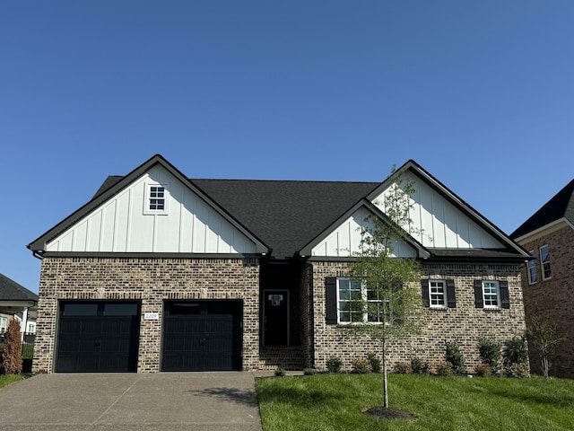 view of front of house featuring a garage and a front yard