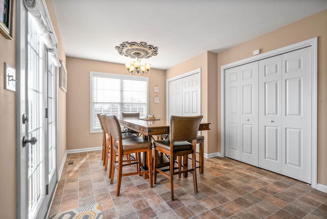 dining area with a notable chandelier