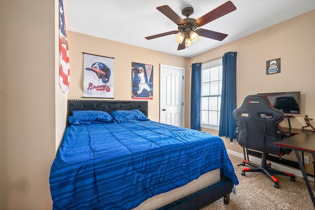 carpeted bedroom with ceiling fan