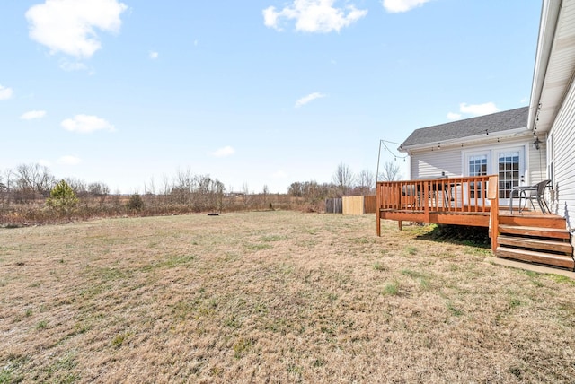 view of yard with a wooden deck