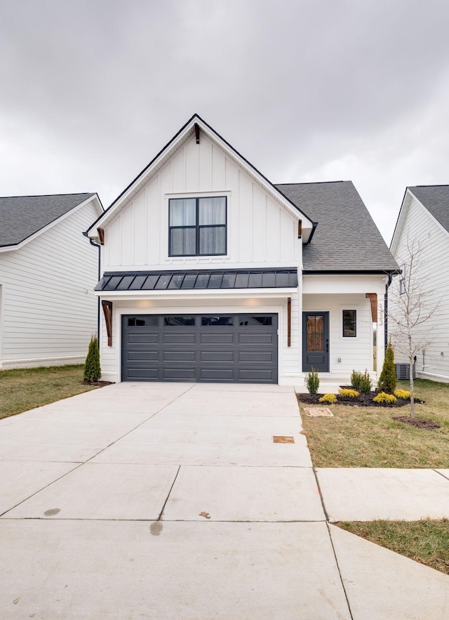 modern farmhouse style home with a garage and a front yard