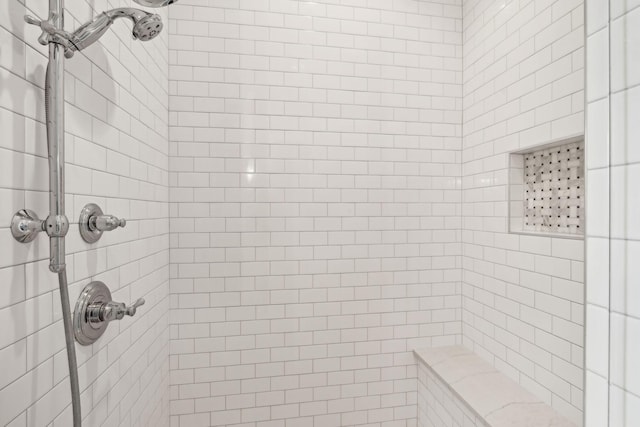 bathroom featuring a tile shower