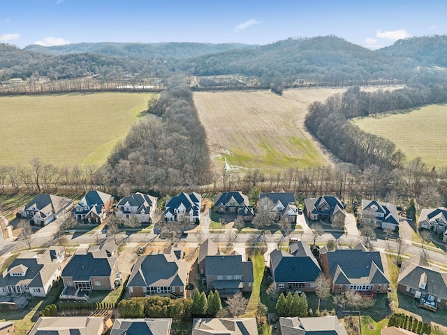 birds eye view of property with a mountain view