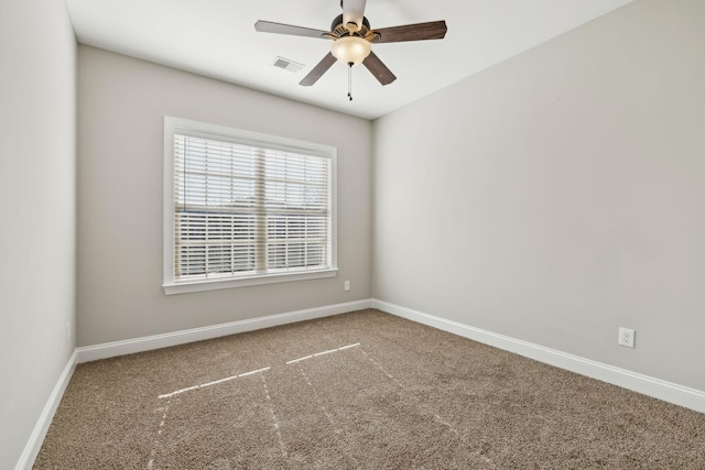 unfurnished room with carpet flooring and ceiling fan