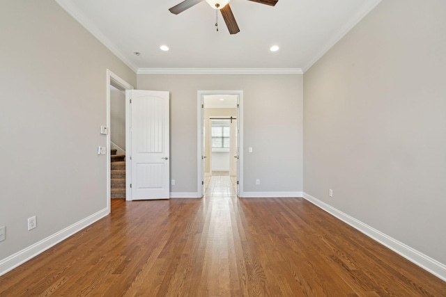 interior space featuring crown molding, hardwood / wood-style flooring, and ceiling fan