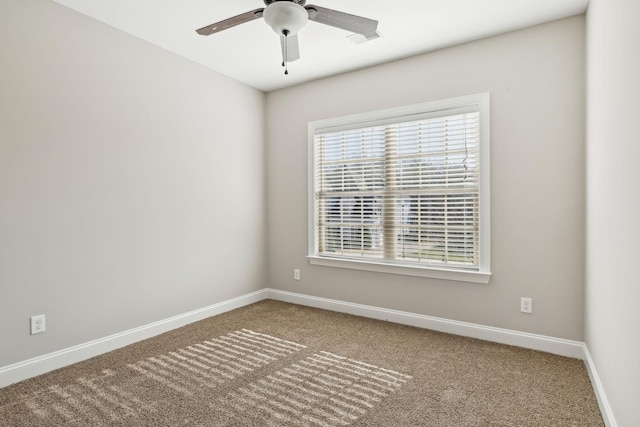 empty room featuring ceiling fan and carpet floors