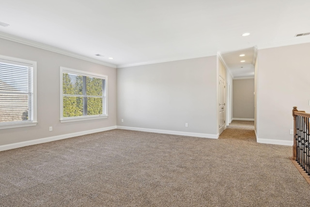 unfurnished room with ornamental molding and light carpet