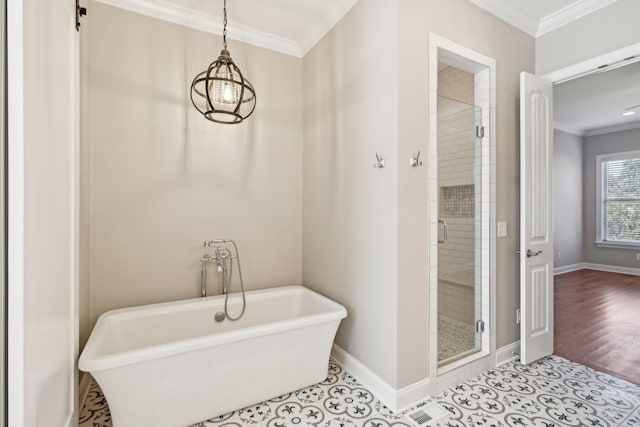 bathroom featuring tile patterned flooring, ornamental molding, and shower with separate bathtub