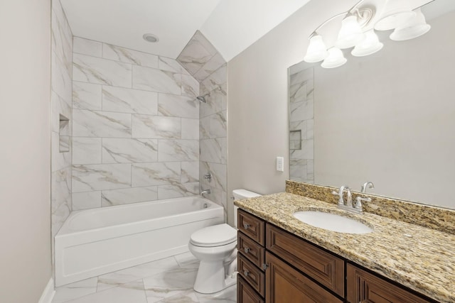 full bathroom with vanity, toilet, and tiled shower / bath