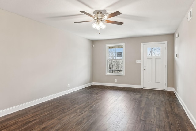 entrance foyer featuring dark hardwood / wood-style flooring and ceiling fan