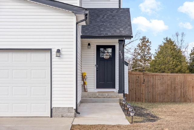 entrance to property featuring a garage