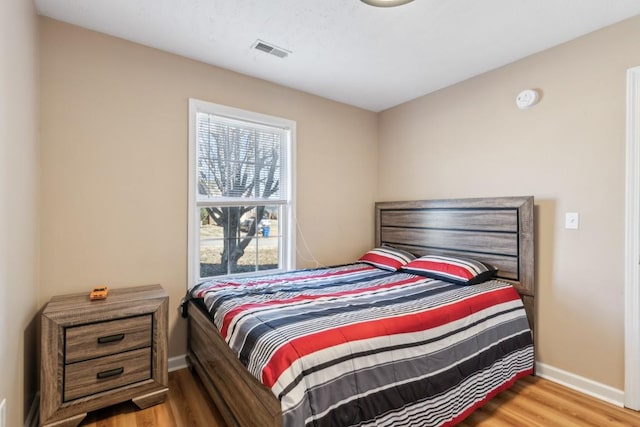 bedroom with light hardwood / wood-style floors