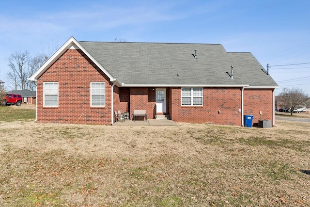 back of house featuring a patio area, central air condition unit, and a lawn