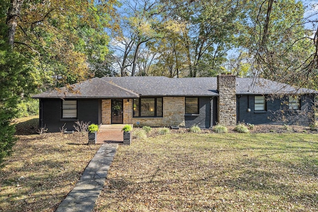 ranch-style home with a front yard