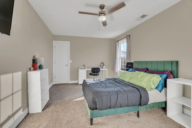 bedroom with a ceiling fan, light colored carpet, visible vents, and baseboards