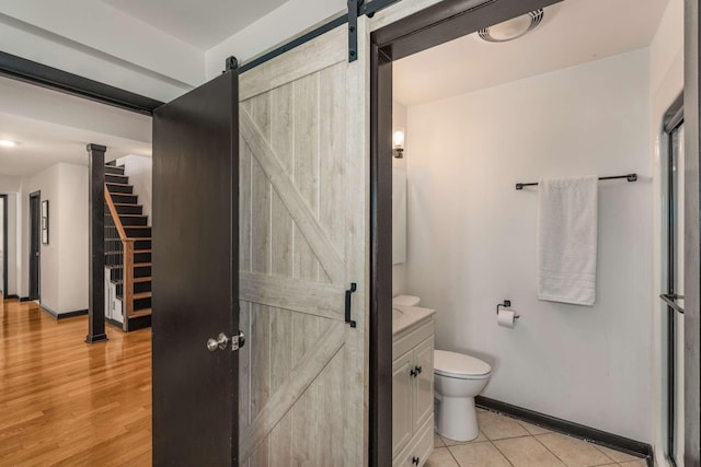 bathroom with vanity, tile patterned floors, and toilet