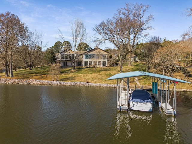 dock area featuring a water view and a yard