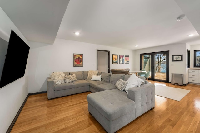 living room featuring light hardwood / wood-style flooring and french doors