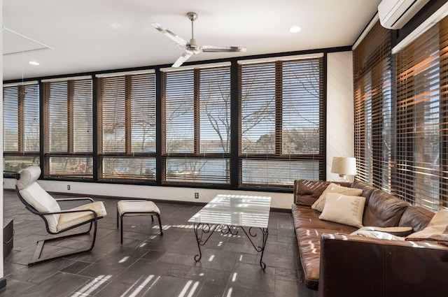 sunroom / solarium with ceiling fan and an AC wall unit