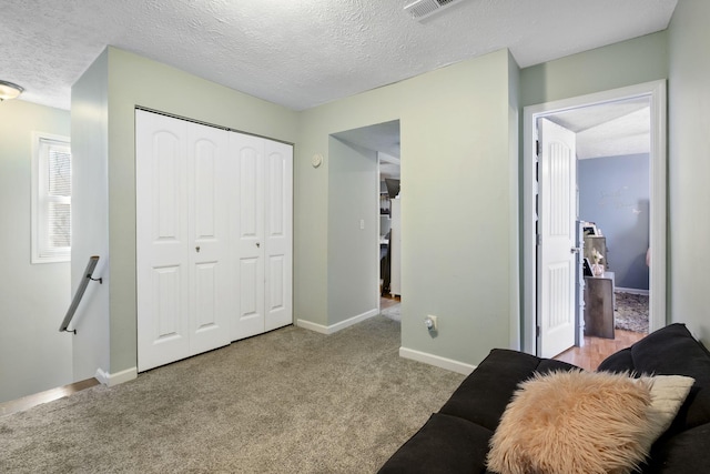 interior space featuring a closet and a textured ceiling