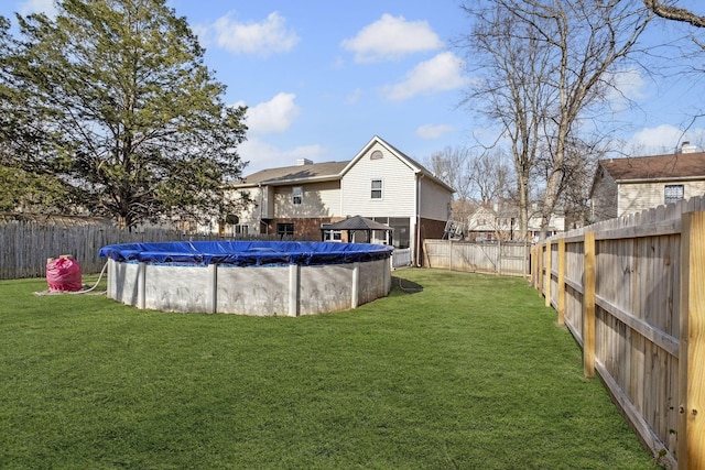 view of yard featuring a covered pool