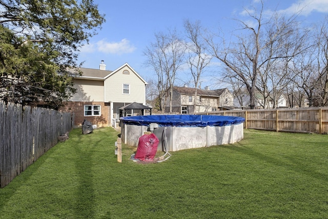 view of yard featuring a covered pool