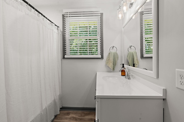 bathroom with a shower with curtain, vanity, and wood-type flooring