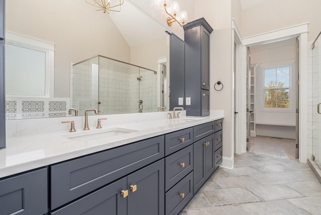 bathroom featuring vanity and an enclosed shower