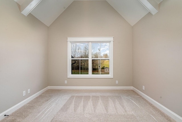 empty room featuring beam ceiling, carpet floors, and high vaulted ceiling