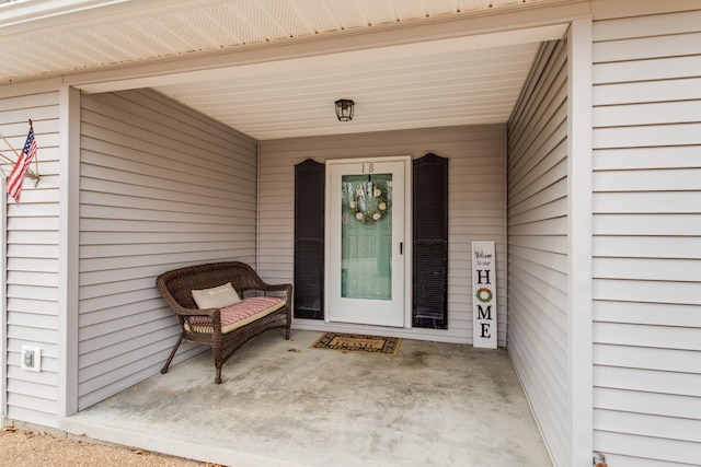 entrance to property featuring covered porch