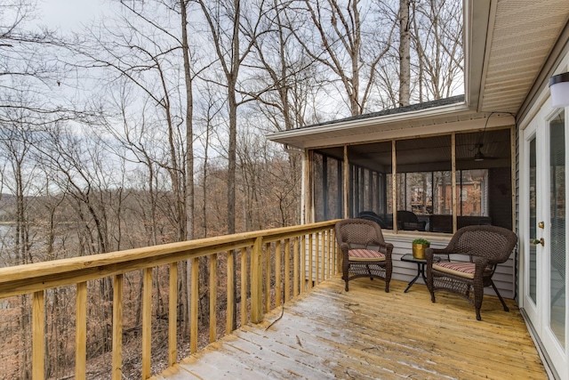 wooden deck featuring a sunroom