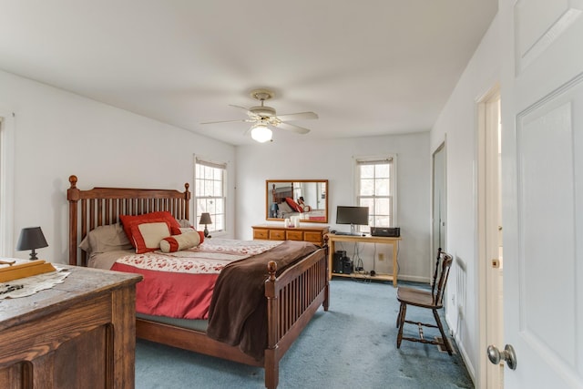 carpeted bedroom with multiple windows and ceiling fan