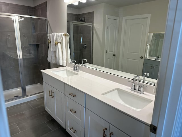 bathroom featuring vanity, tile patterned floors, and walk in shower