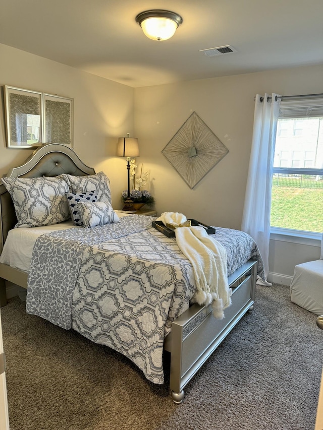 bedroom featuring dark colored carpet