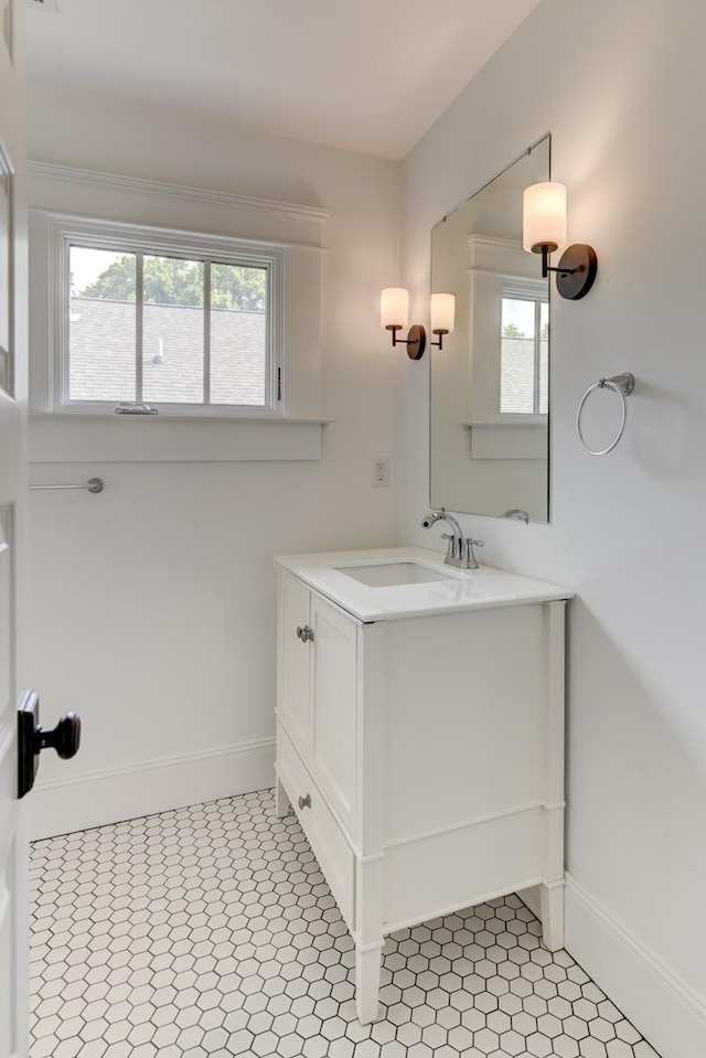 bathroom with vanity, tile patterned flooring, and a wealth of natural light