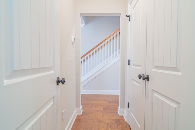 hallway with light hardwood / wood-style flooring