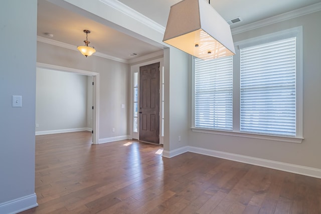 foyer with dark hardwood / wood-style flooring and ornamental molding