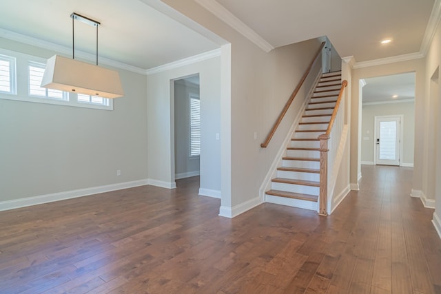 stairs featuring hardwood / wood-style floors and crown molding