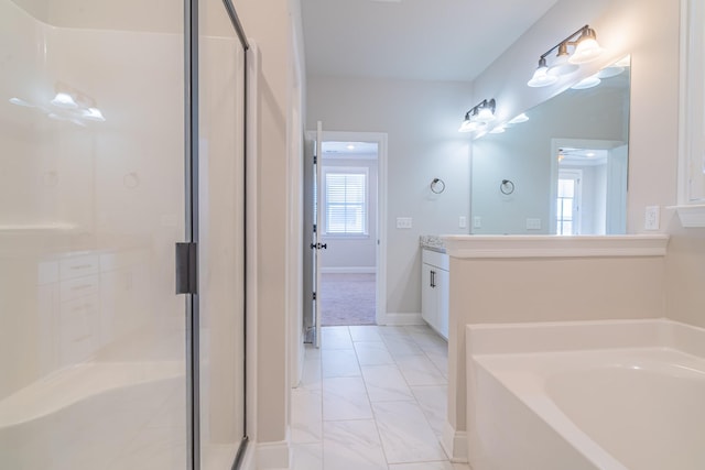 bathroom with vanity and independent shower and bath