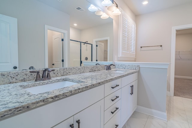 bathroom with vanity and walk in shower