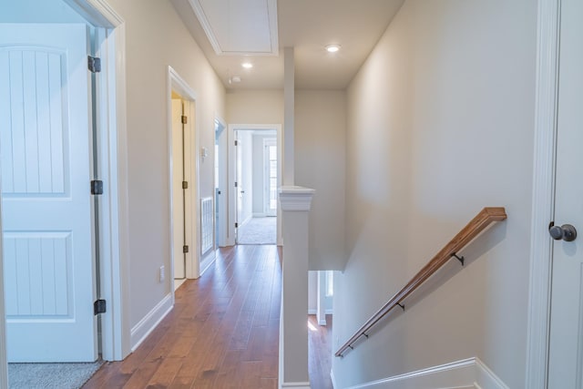 hall with wood-type flooring