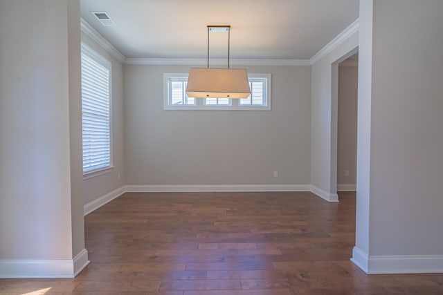 unfurnished dining area with crown molding and dark hardwood / wood-style floors