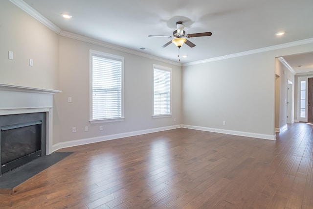 unfurnished living room featuring crown molding, dark hardwood / wood-style floors, and ceiling fan