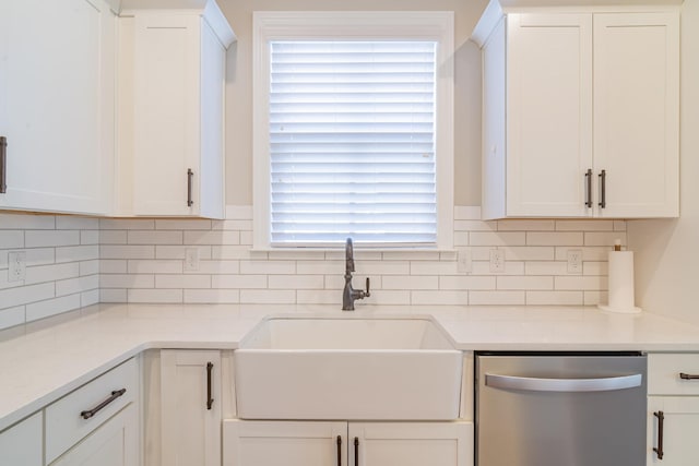 kitchen featuring sink, white cabinets, and dishwasher