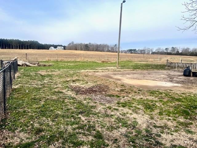 view of yard with a rural view