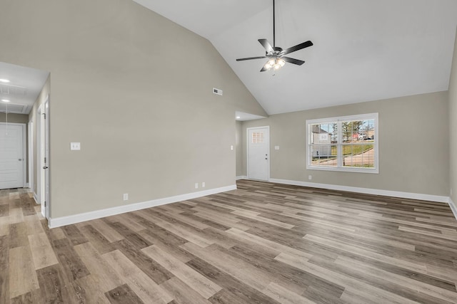 unfurnished living room featuring ceiling fan, high vaulted ceiling, and light hardwood / wood-style flooring