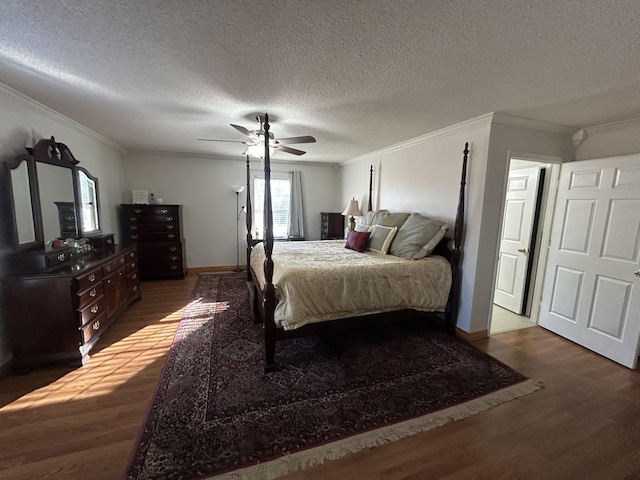 bedroom with dark hardwood / wood-style flooring, ceiling fan, crown molding, and a textured ceiling